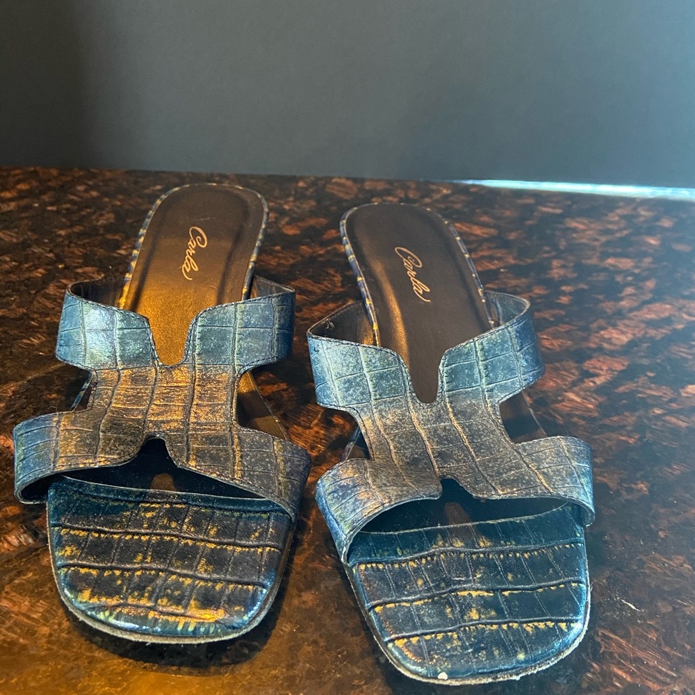 Slip on sandals.